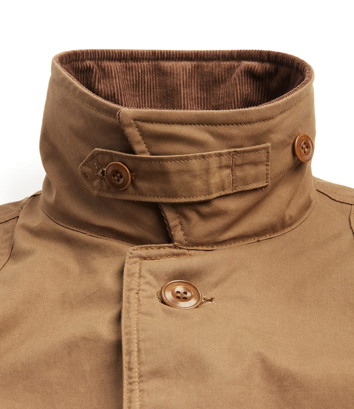 Close-up of the Best Made Co. Wool-lined Waxed Field Jacket Tan, featuring a high collar with corduroy lining, brown buttons, and a neck strap detail. The durable, all-weather design ensures reliable outerwear performance.