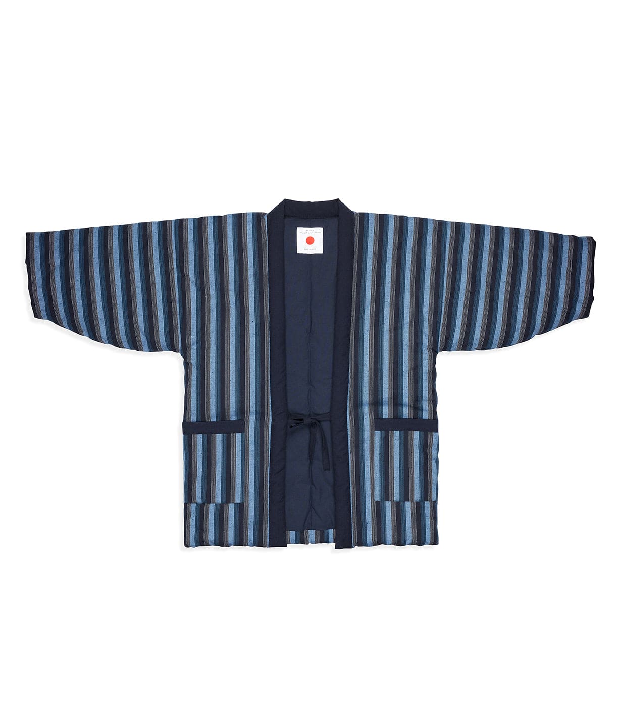 The Best Made Co. Quilted Hanten Jacket is a traditional style with wide sleeves, navy base, blue and gray stripes, front pockets, tie closure, and a red dot label inside the collar.