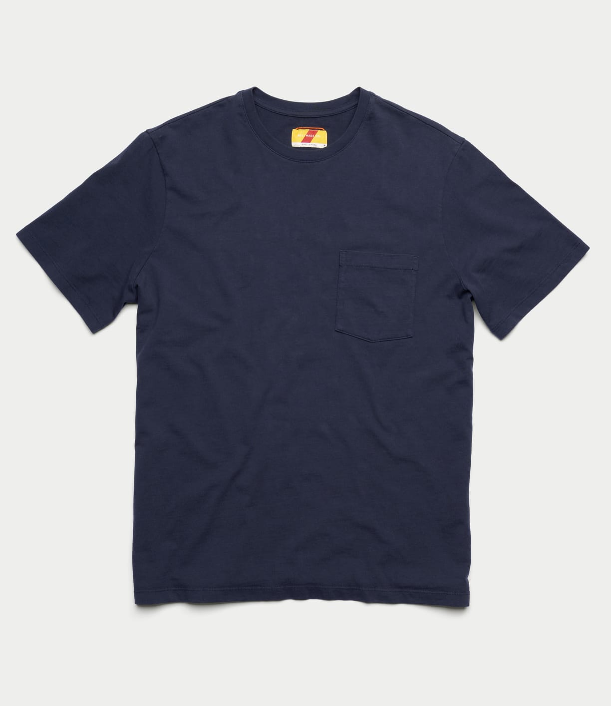 The Best Made Co Standard Pocket T-Shirt Navy is a soft Peruvian tangüis cotton short-sleeve tee with a chest pocket, shown flat on a white background.