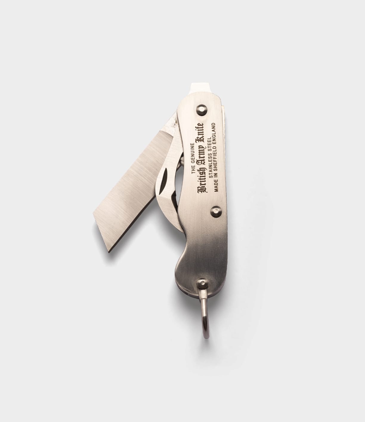 The Best Made Co. British Army Knife, a stainless steel folding pocket knife with two extended blades and engraved handle, is displayed against a plain light gray background.