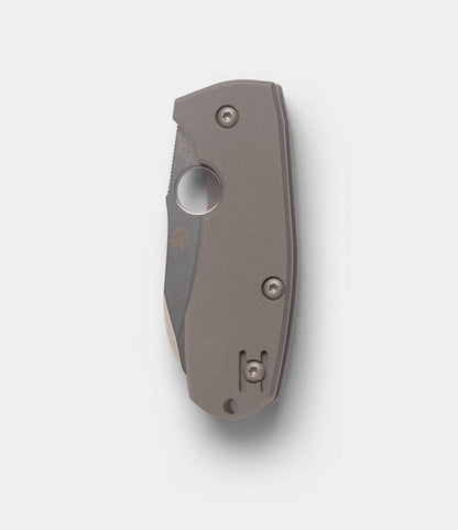 The Spyderco Techno 2 by Best Made Co. is a closed folding pocket knife featuring a matte gray titanium framelock handle, visible screws, and a premium CTS-XHP steel blade, shown against a plain white background.