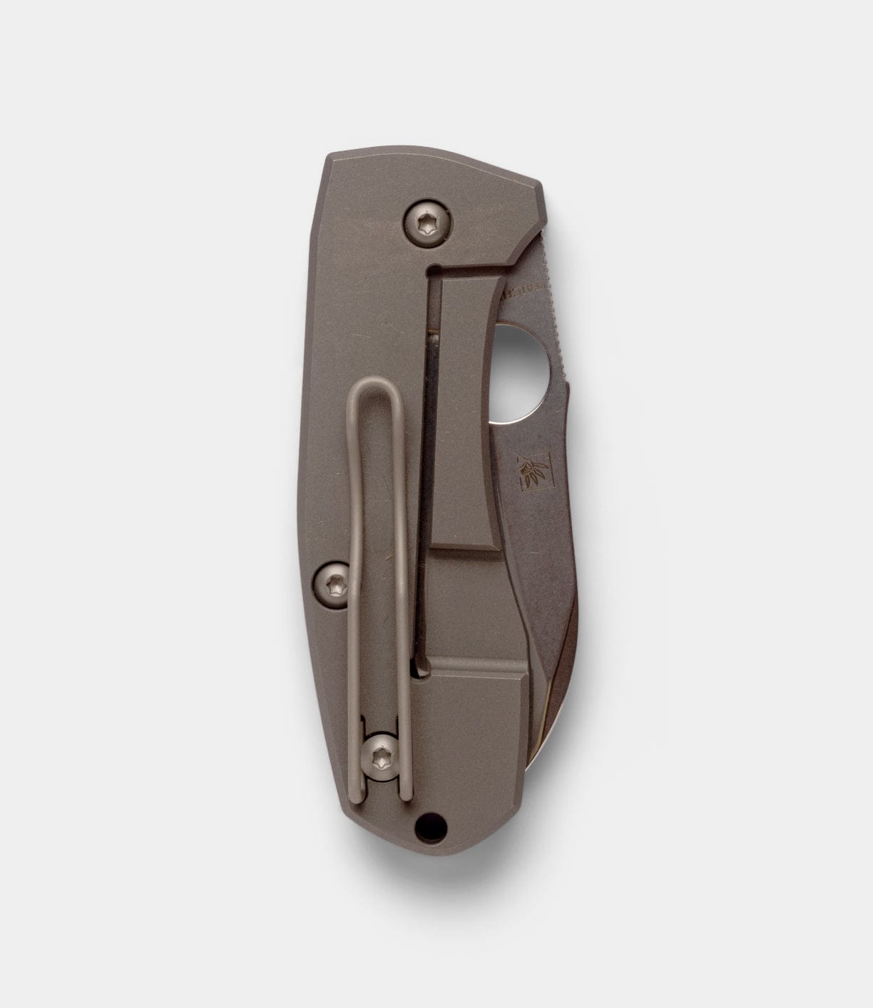The Best Made Co Spyderco Techno 2 is a folded pocket knife with a matte metal finish, sturdy pocket clip, and partially visible CTS-XHP steel blade featuring a thumb hole, shown against a plain white background.