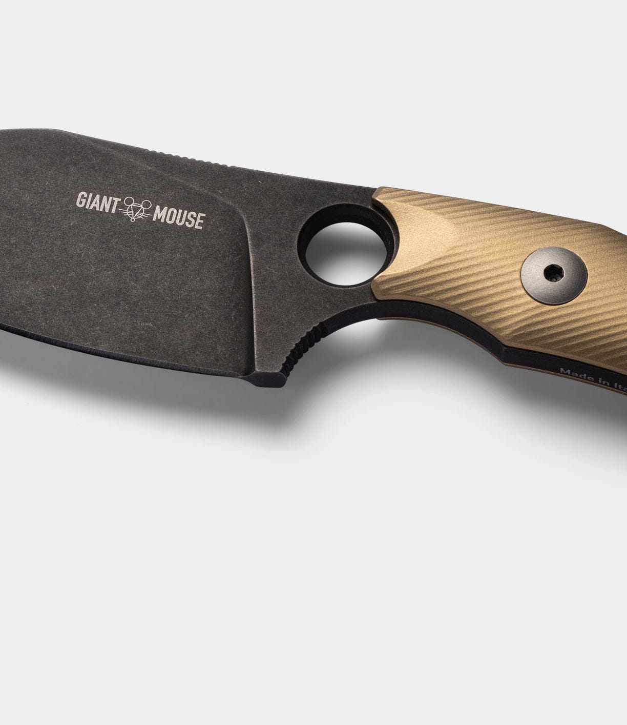 Close-up of the Best Made Co GiantMouse GMF1-P (BMC Edition) fixed blade knife with a black N690 steel blade labeled GIANT MOUSE and a brown textured handle, against a plain light background.
