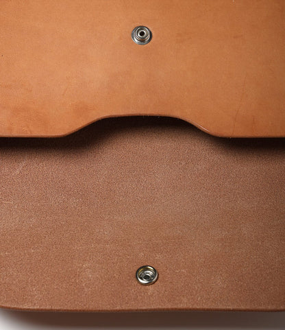 Close-up of the Best Made Co. Gfeller Case Small, showing its hand-stitched leather, detailed texture, inside flap, and two snap button fasteners—highlighting the expert craftsmanship of this distinctive case.