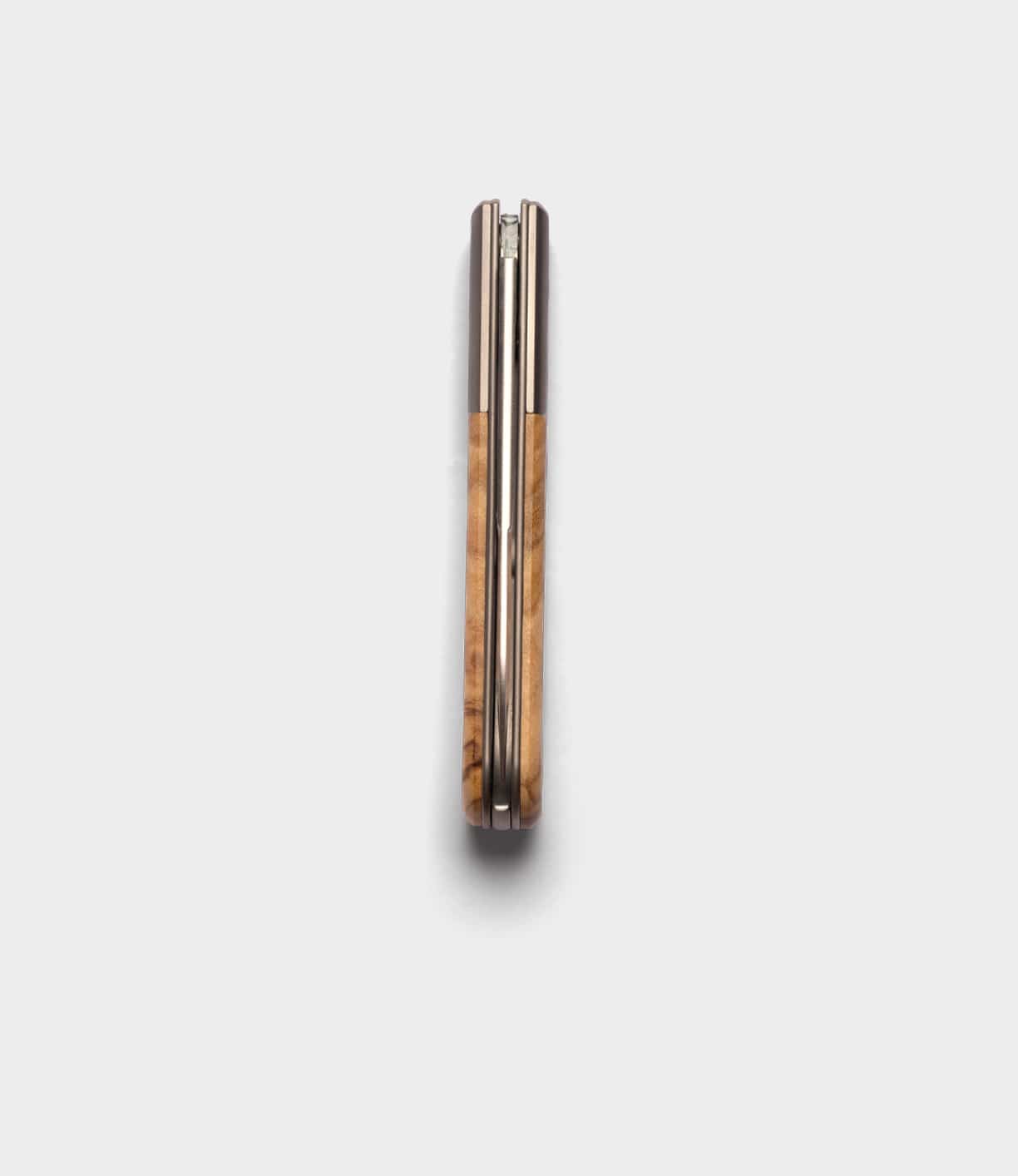 The Best Made Co. Italian Barlow knife, featuring an M390 stainless steel blade and wooden handle, is shown closed from above on a white background.