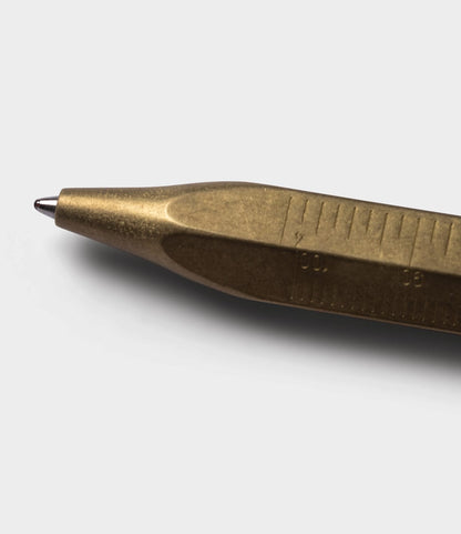 A close-up of the Brass Messograf Pen by Best Made Co., showcasing its precise measurement markings along the brass body, set against a plain light gray background.
