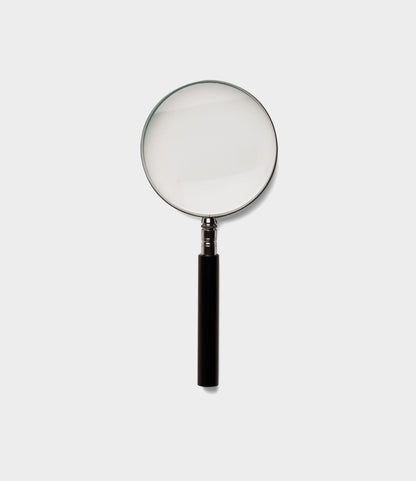The Best Made Co. Japanese Magnifying Glass, featuring a black handle and a round, scratch-resistant optical glass lens, is centered on a plain white background.