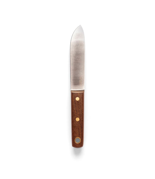 A Best Made Co. Sailor’s Knife with a Brazilian Teak handle rests on brown fabric between coiled rope and canvas with a red stripe.