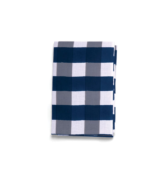 A folded Benkei-Jima Tenugui by Best Made Co., a hand-dyed Japanese cloth with large navy blue, gray, and white checkered squares, is displayed on a plain light background.