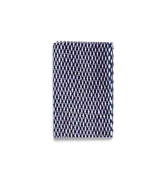 The Ami Net Tenugui by Best Made Co. is a folded rectangular Japanese tenugui with a white background and repeating navy blue diamond mesh pattern, crafted using the traditional chusen technique.
