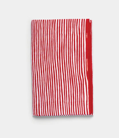 The Yoroke-Jima Tenugui by Best Made Co. features vertical red and white stripes on a plain white background, hand-dyed using the traditional Japanese chusen technique.