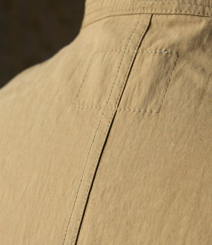 Close-up of the Possibilities Jacket Tan by Best Made Co., showcasing visible stitching, a vertical seam, and textured Japanese cotton fabric that highlight the craftsmanship and durability of this lightweight outerwear.