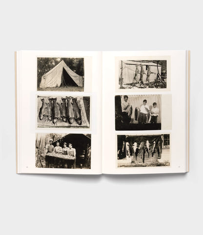 The open book "Will Write Soon" by Best Made Co. showcases six black-and-white vintage photos of rural America, featuring a tent, animal pelts, anglers with caught fish, and a group outside a rustic cabin.