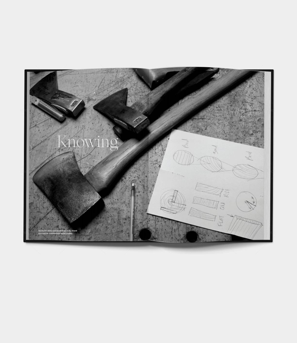 Black-and-white photo of three axes from Best Made Co on a worn surface with sketches and a pencil. “Knowing” is overlaid—an image inspired by Buchanan-Smith’s Axe Handbook (unsigned).